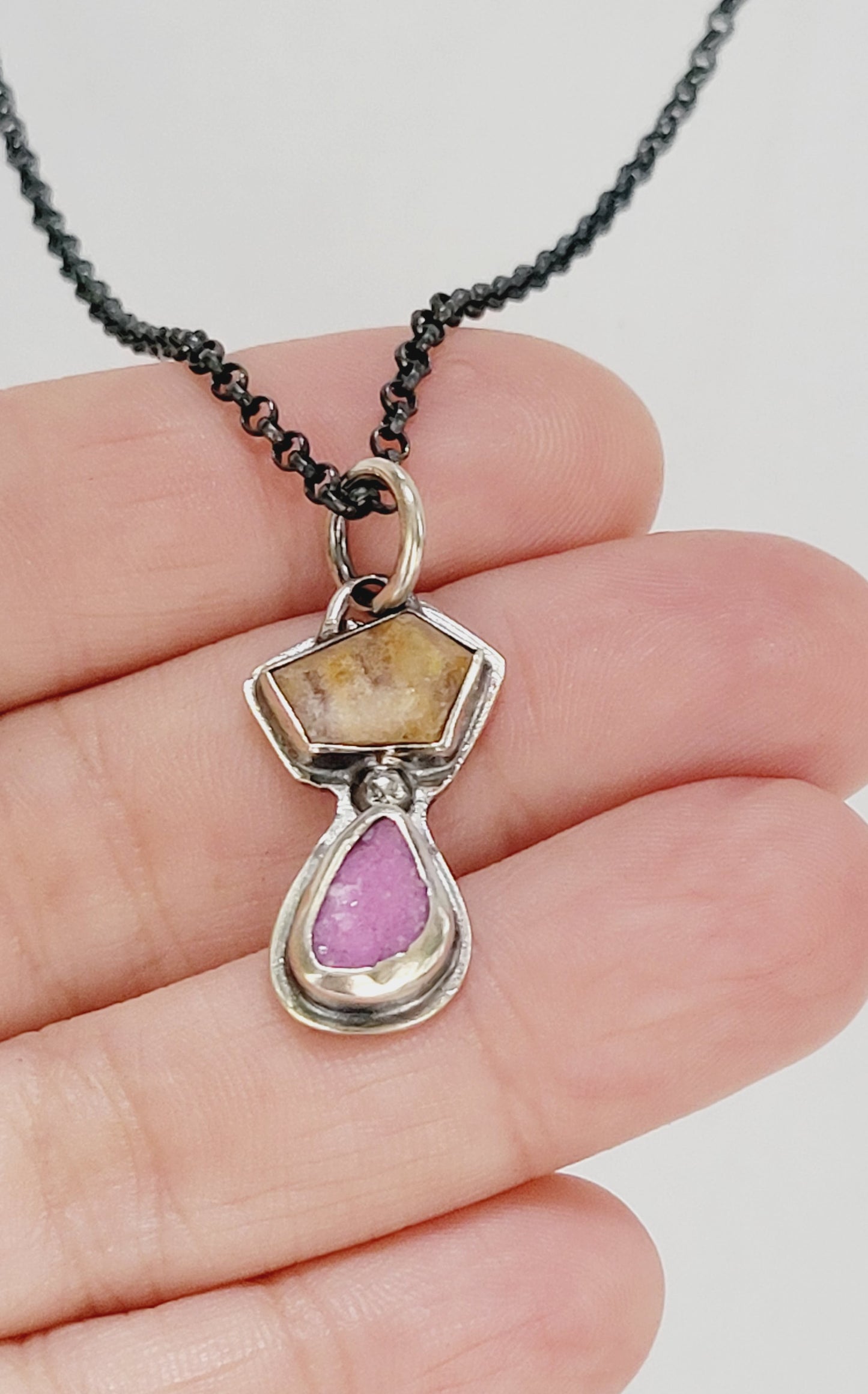 Handmade sterling silver pendant set with a citrine topaz and a cobalt mineral
