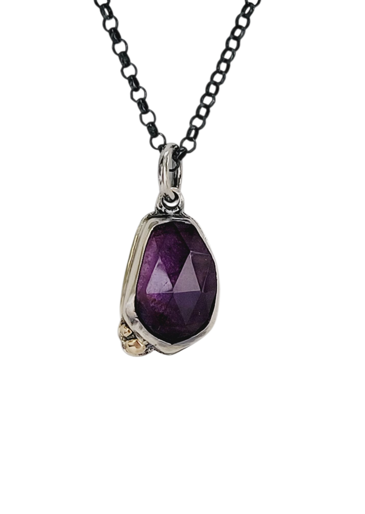 Pendant set amethyst in sterling silver with 14k gold details.