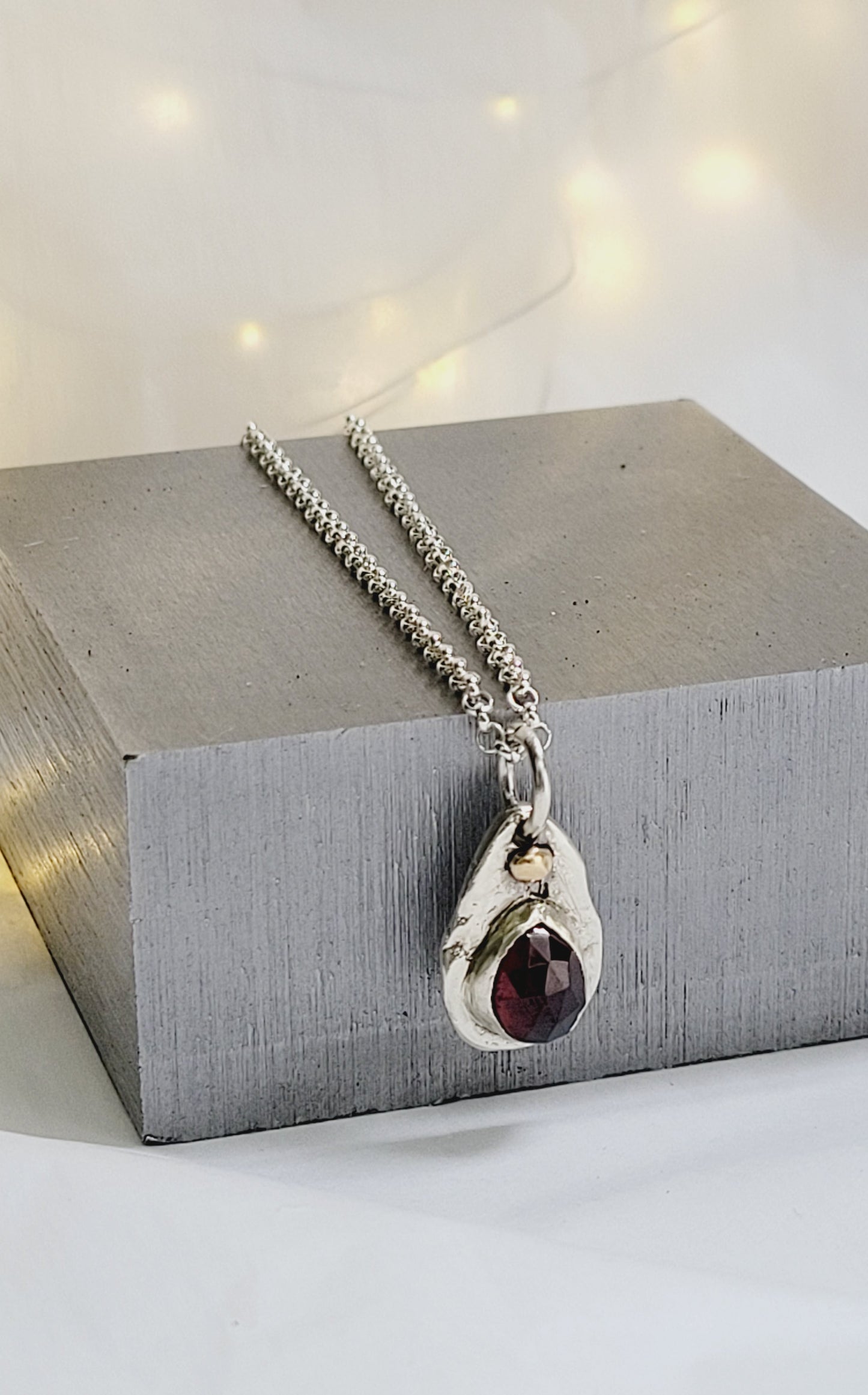 Sterling Silver pendant with Garnet and 14K Gold