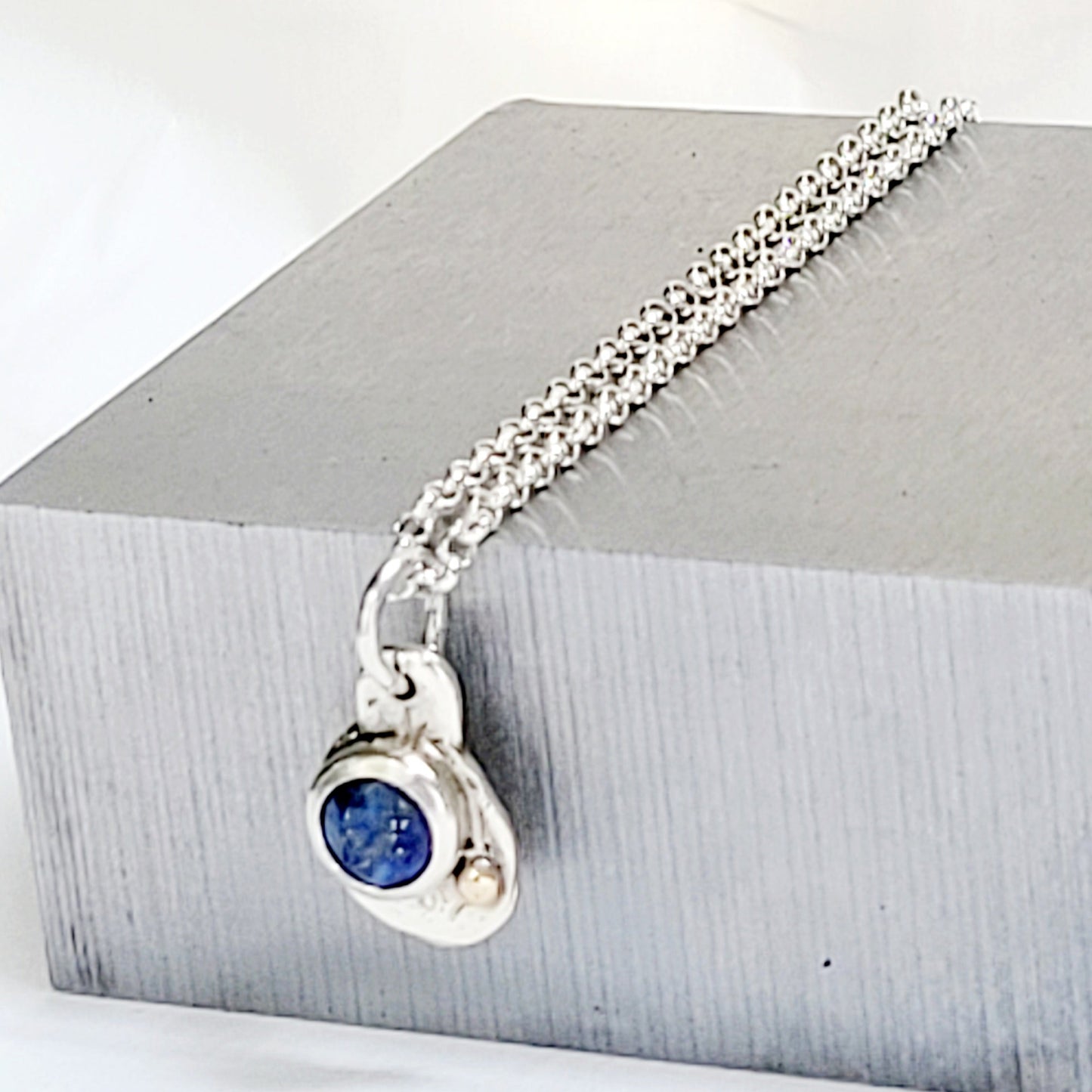Sterling silver pendant with faceted Lapislazuli and 14k gold