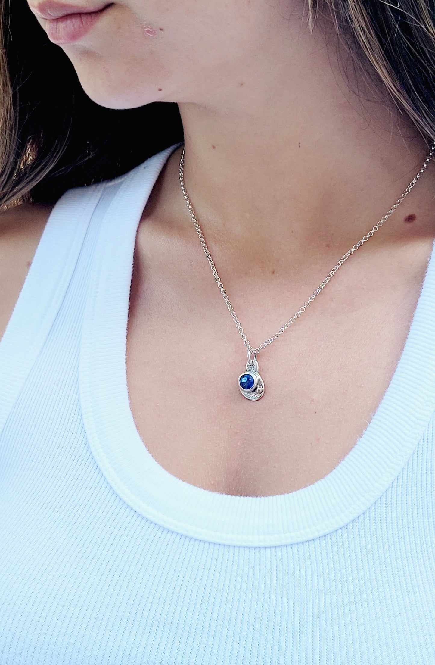 Sterling silver pendant with faceted Lapislazuli and 14k gold