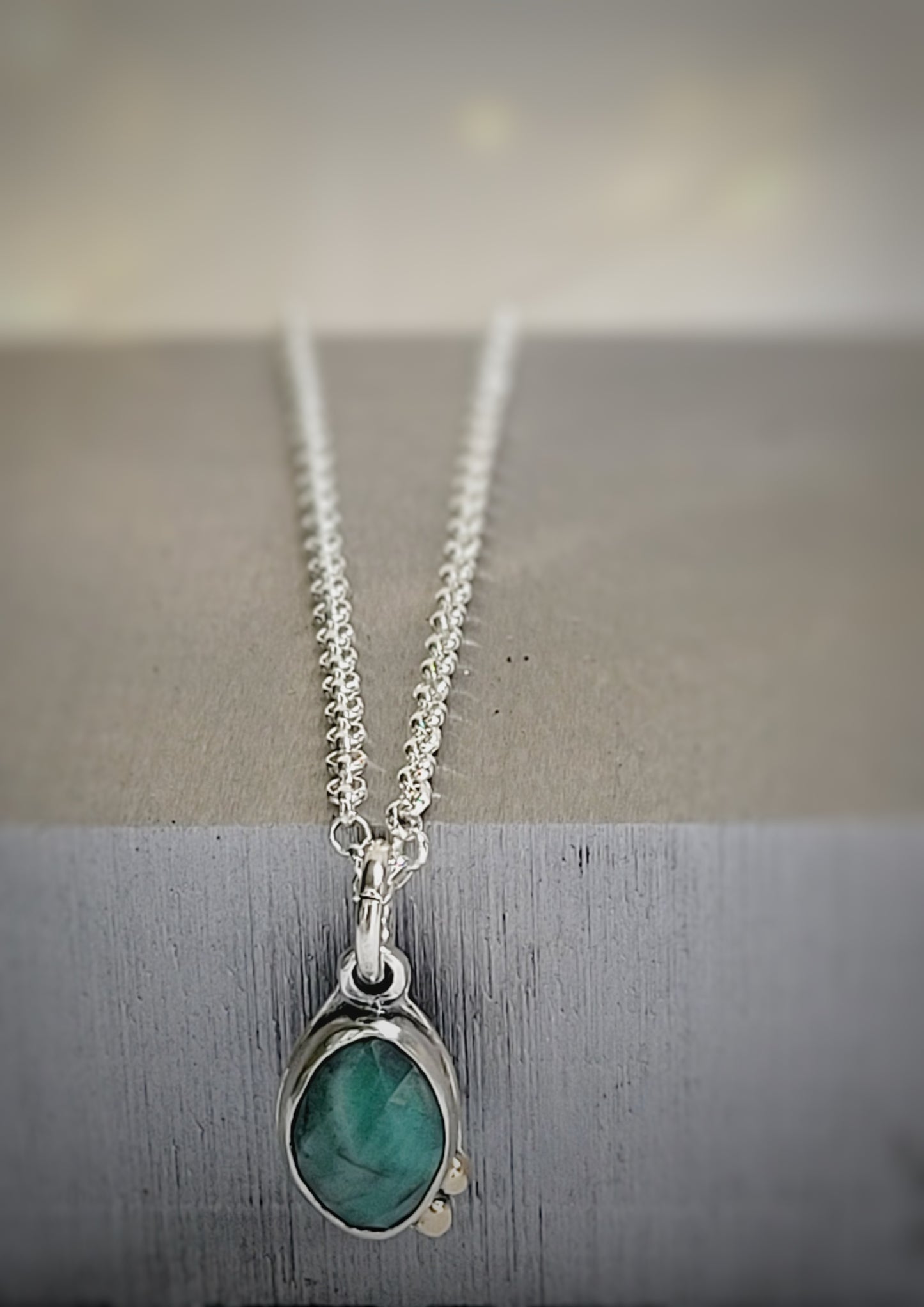 Sterling Silver pendant with Faceted Emerald and 14k gold