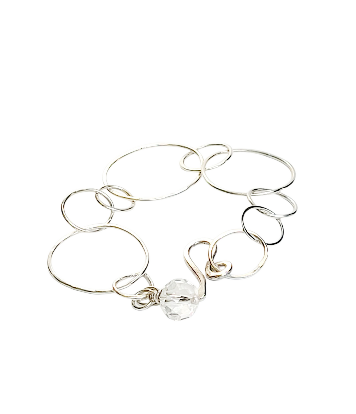 Sterling Silver bracelet features hammered rings.