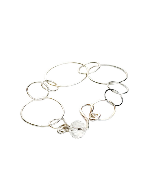 Sterling Silver bracelet features hammered rings.