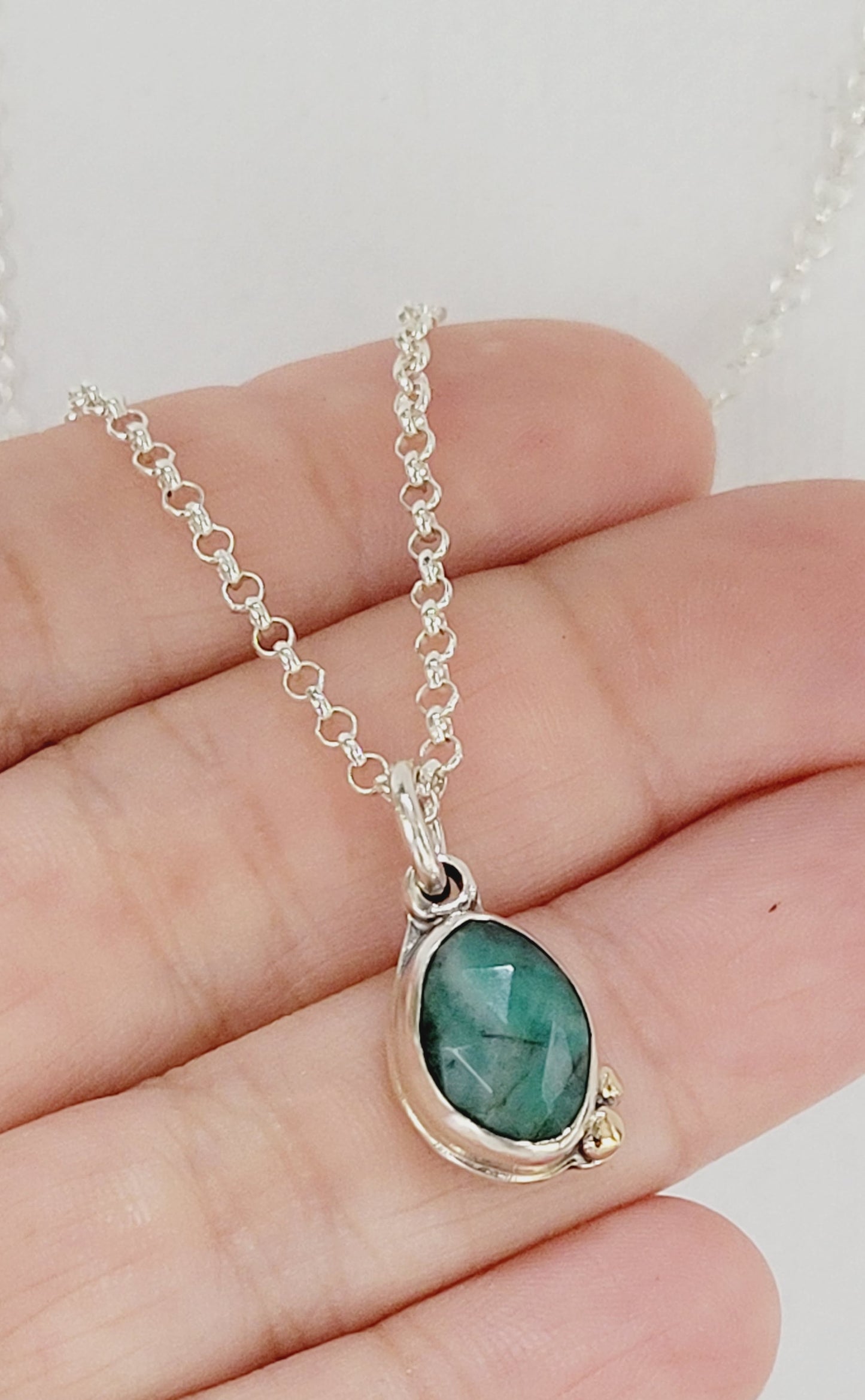 Sterling Silver pendant with Faceted Emerald and 14k gold