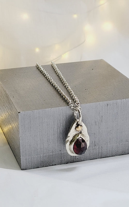 Sterling Silver pendant with Garnet and 14K Gold